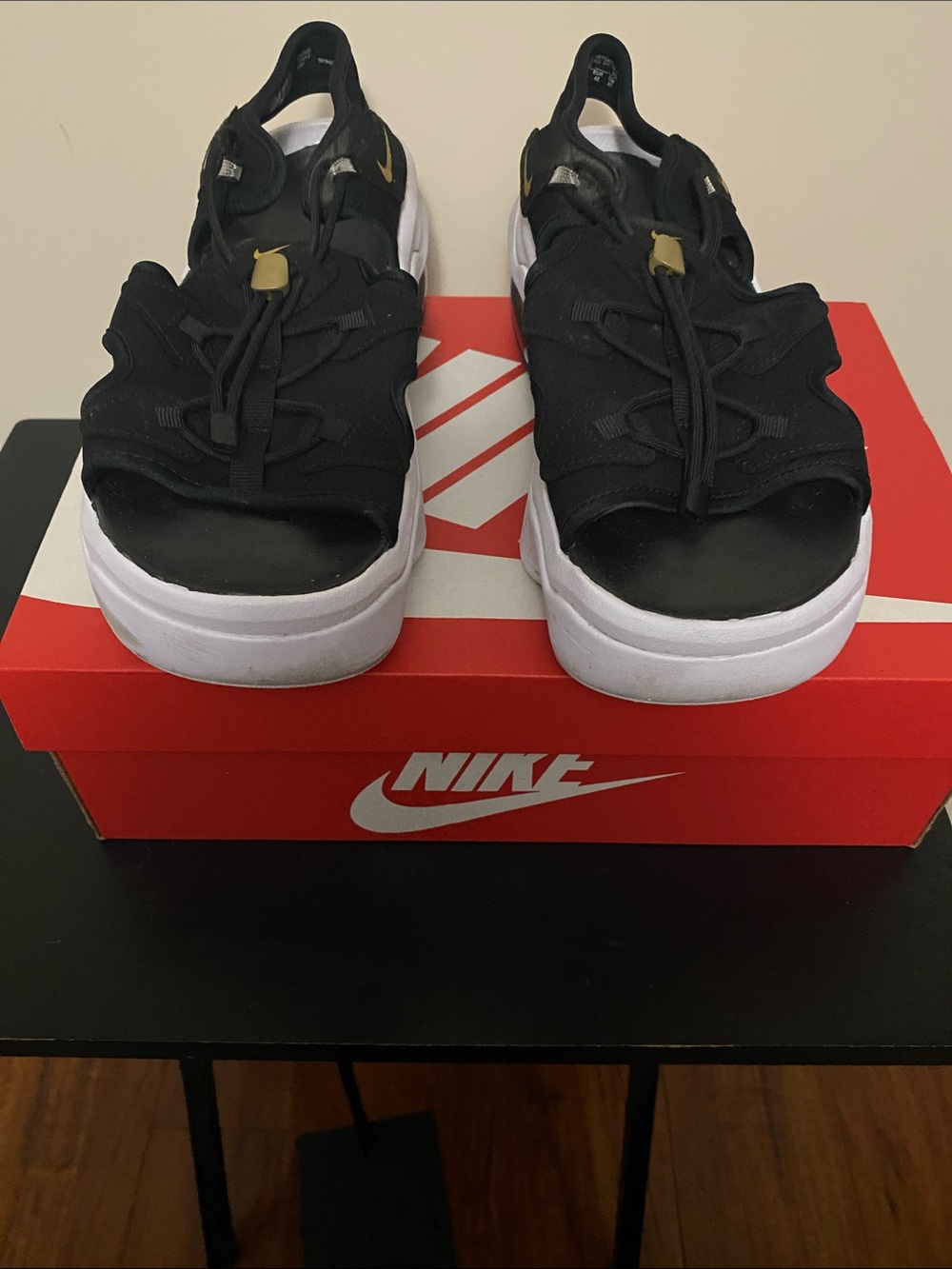 Nike Air Max Koko Women’s Black Sandal-Sneaker with White Sole and Gold Accents